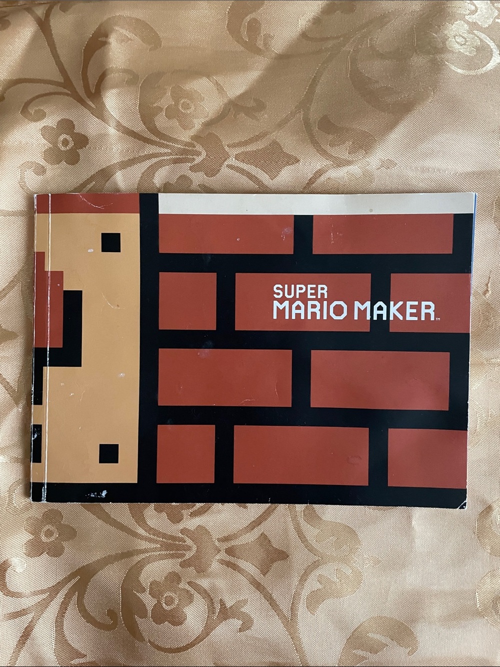 Nintendo Super Mario Maker Brick-Pattern Booklet in Red, Black, Tan